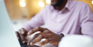 Man writing cover letter on laptop